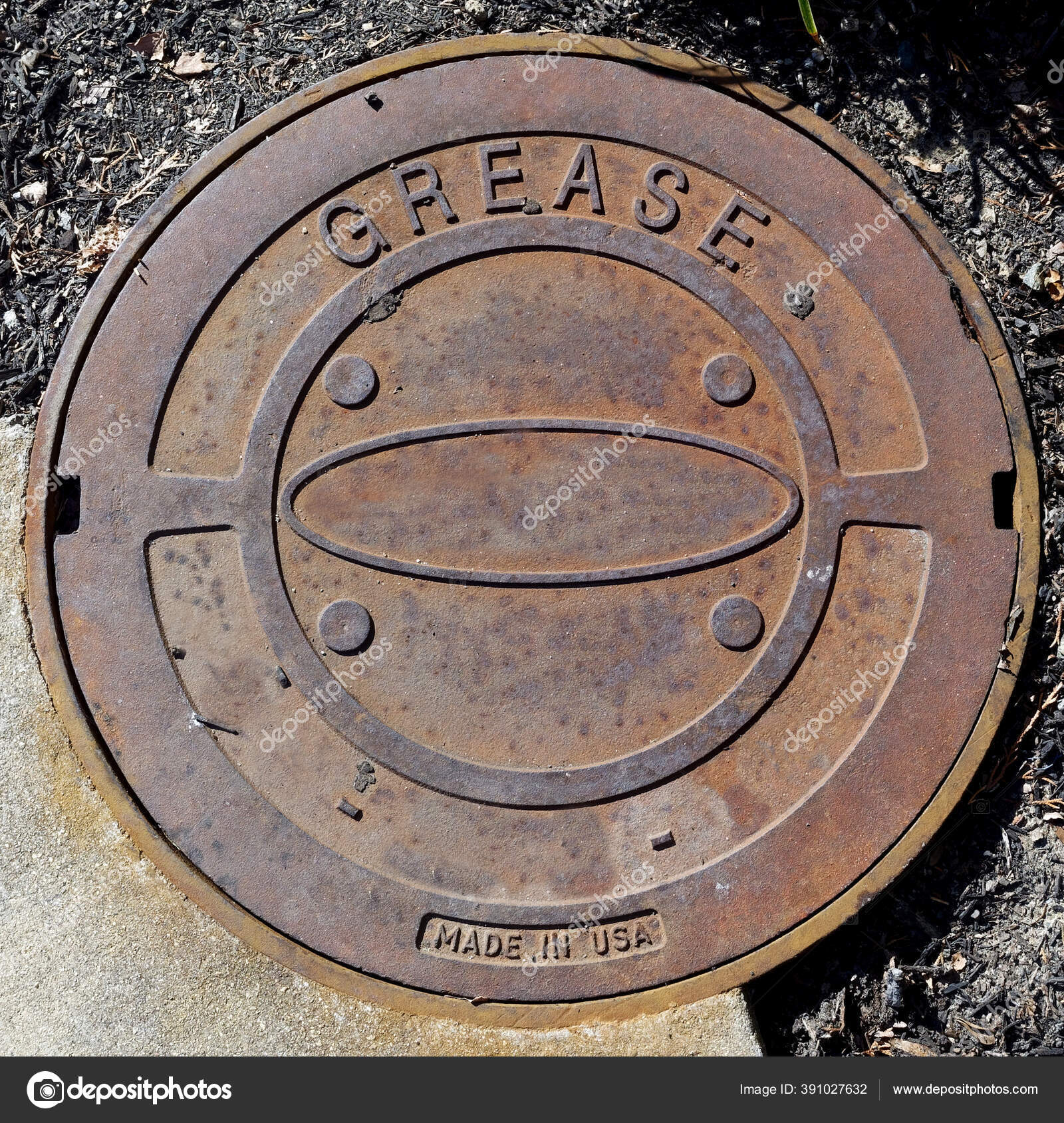Unusual Manhole Grease Trap Cover Labeled Grease Stock Photo by