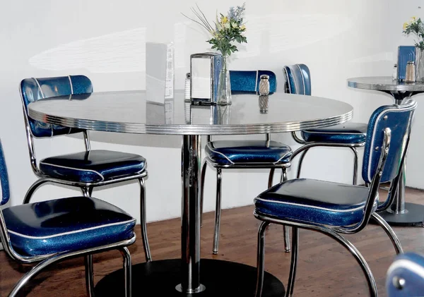 Vintage blue diner chairs and table setting.