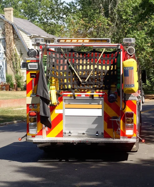 Rear view of fire truck on residential city street.