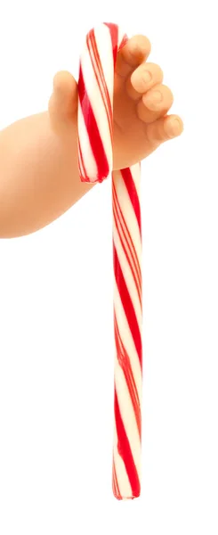 Infant Doll Hand Holding Red White Striped Christmas Candy Cane — Stock Photo, Image