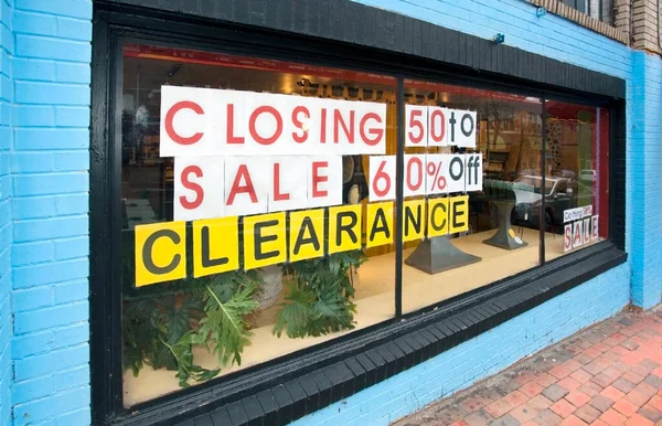 Store window announcing CLOSING CLEARANCE SALE.