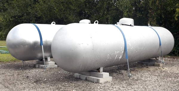 Two industrial propane tanks. Horizontal.