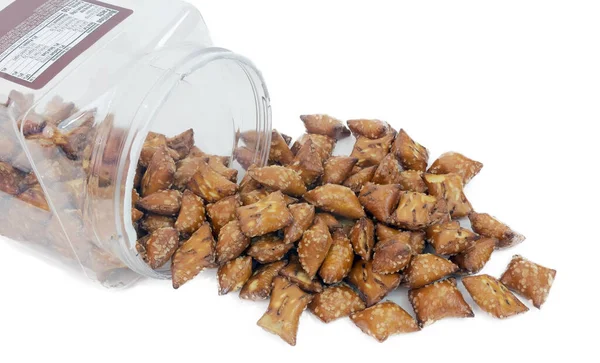 Peanut Butter Pretzels Spilling Clear Plastic Container Isolated — Stock Photo, Image