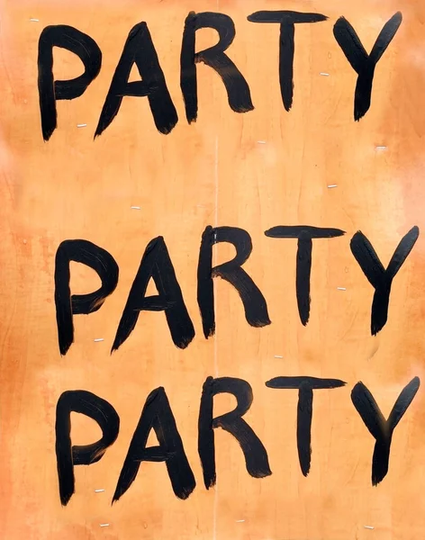 Homemade black on orange PARTY PARTY PARTY Sign. Vertical.