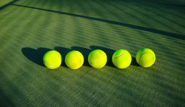Tennis balls on court wallpaper