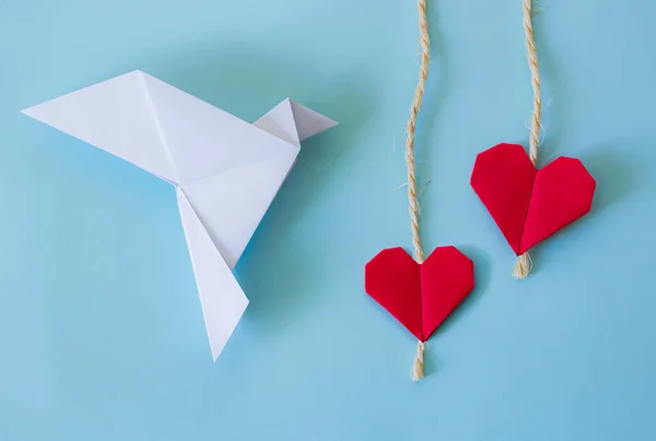 origami background with peace white dove and red hearts