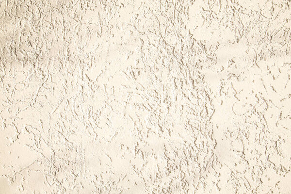 Бежевый фасад штукатурки. Однослойный монолитный гипсовый декоративный фон. Однослойные клееные обои из цементной штукатурки. Внешний вид строения. Силикатный песок Цементный гипс. Копирование пространства

