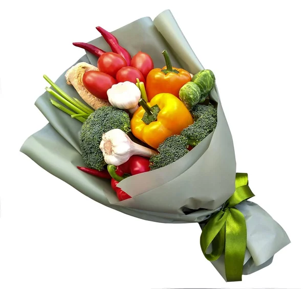 edible bouquet of vegetables for man, in green package with green ribbon, surprise, a snack made from red and yellow peppers, tomatoes, chili pepper, broccoli and Brussels sprouts and garlic. isolated