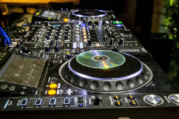 Professional party dj sound mixer controller. Play & remix music tracks at party or concert with modern audio equipment.