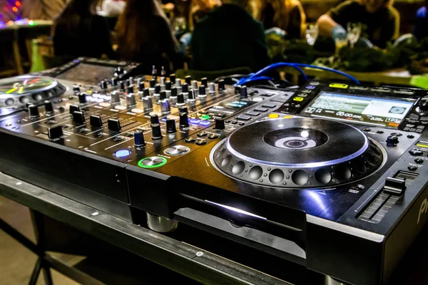 Professional party dj sound mixer controller. Play & remix music tracks at party or concert with modern audio equipment.