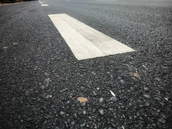 Road traffic paint White on the asphalt surface — Stock Photo, Image