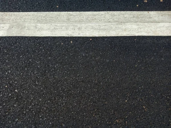 Road traffic paint White on the asphalt surface — Stock Photo, Image