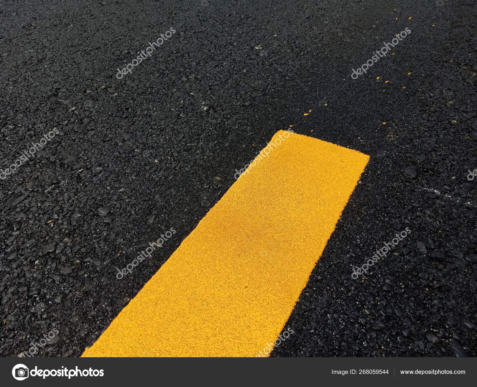 Road traffic paint Yellow on the asphalt surface Stock Photo by 268059544