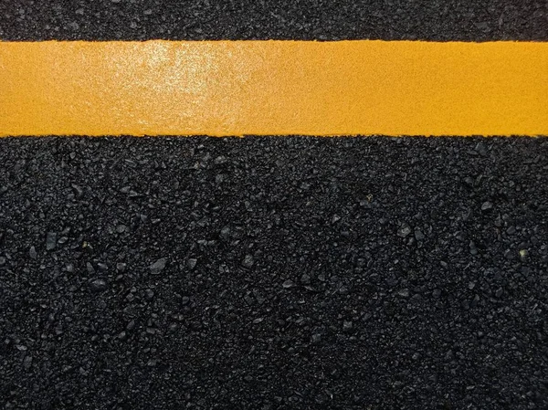 Road traffic paint Yellow on the asphalt surface