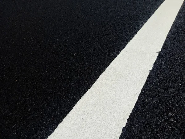 Road traffic paint White on the asphalt surface — Stock Photo, Image