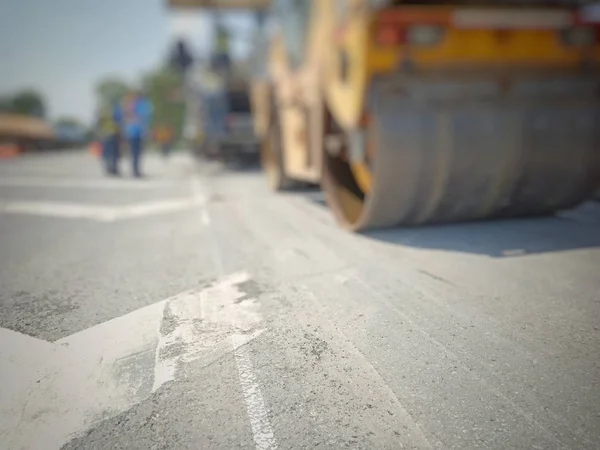 Road maintenance by burning old materials and improving quality