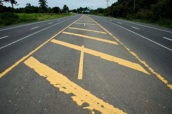 Road traffic paint Yellow on the asphalt surface