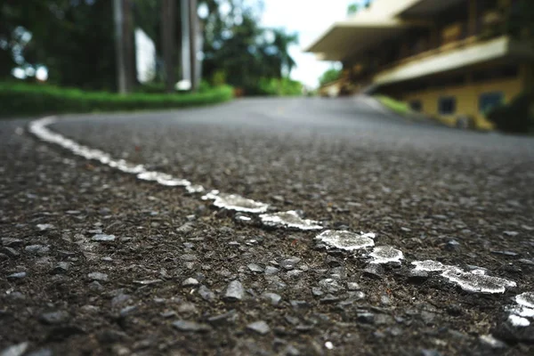 Road traffic paint on the asphalt surface