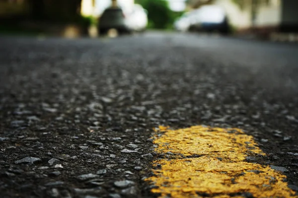 The paved road has yellow traffic lines on the surface. Blurred — Stock Photo, Image