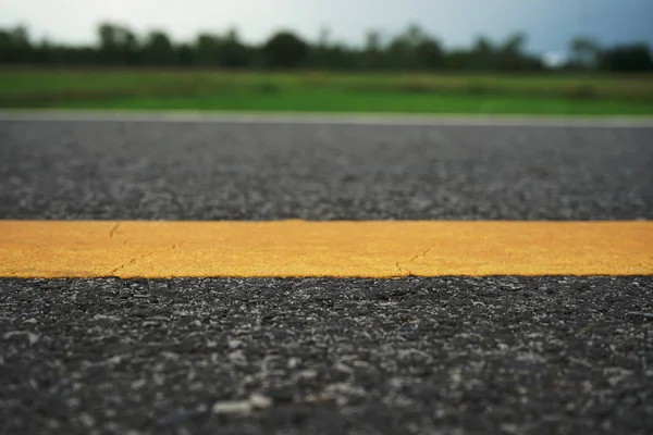 Road traffic paint Yellow on the asphalt surface — Stock Photo, Image