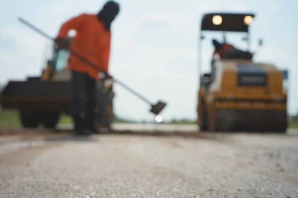 Repairing a damaged road To allow people to travel safely (blurr — Stock Photo, Image