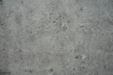 Beton bir yüzeye beton dökülmesinden kabarcıklar var. 