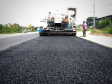 ASPHALT HOT MIX IN - Place RECYCLING (bulanık resim).
