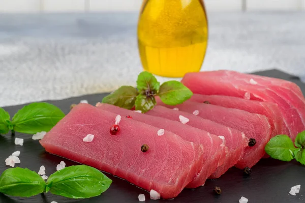 Fresh Raw Tuna Steak Basil Olive Oil Black Rustic Background — Stock Photo, Image