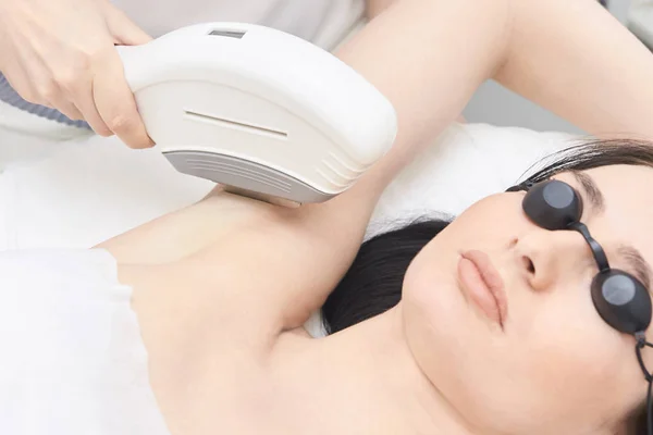 Medical procedure. Bright skin. Removing underarm hair. Laser hair removal.