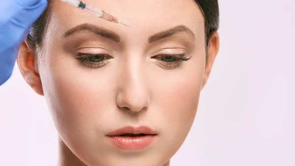 woman face injection. salon cosmetology procedure. skin medical care.  dermatology treatment. anti aging wrinkle lifting.