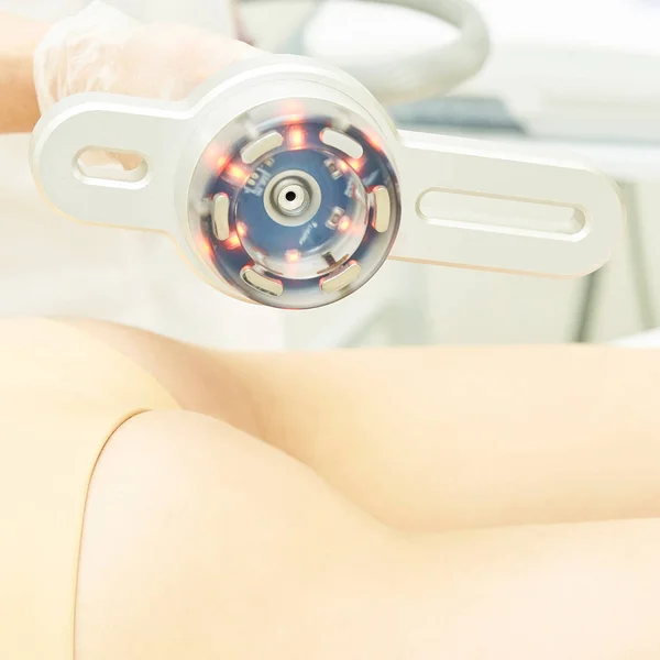 Cavitation cosmetology woman procedure. Lipo ultrasonic machine. Body anti cellulite treatment. Ultrasound radio girl therapy.