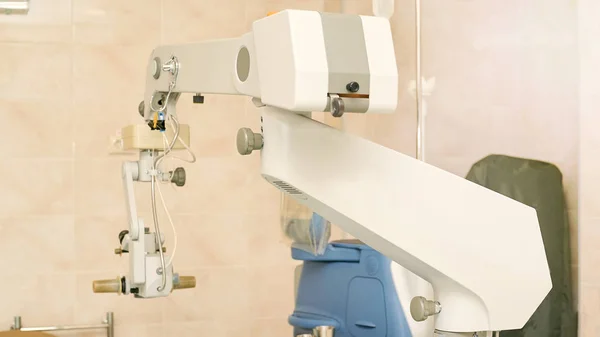 Ophthalmology laser microscope operation. Clinic room with doctor and parient. Gloves and medicine tools — Stock Photo, Image