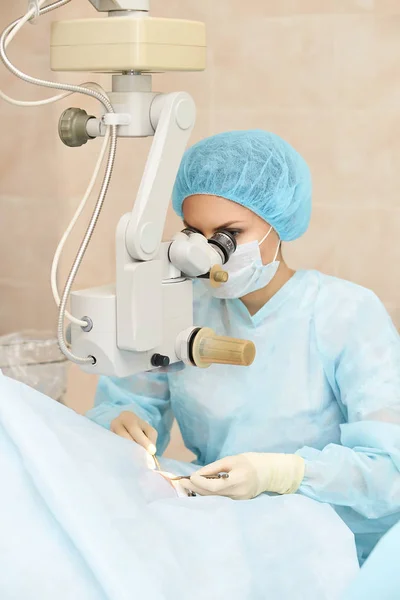 Ophthalmology laser microscope operation. Doctor in clinic. Patient eye treatment. Myopia and cataract removal — Stock Photo, Image