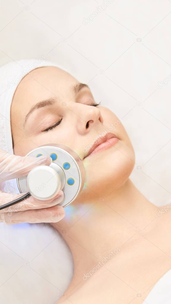 Light infrared therapy. Cosmetology head procedure. Beauty woman