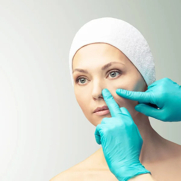 Female derma rejuvenate treatment. Doctor in gloves touch woman face. Cosmetology pretty portrait. Facial nosr injection patient — Stock Photo, Image