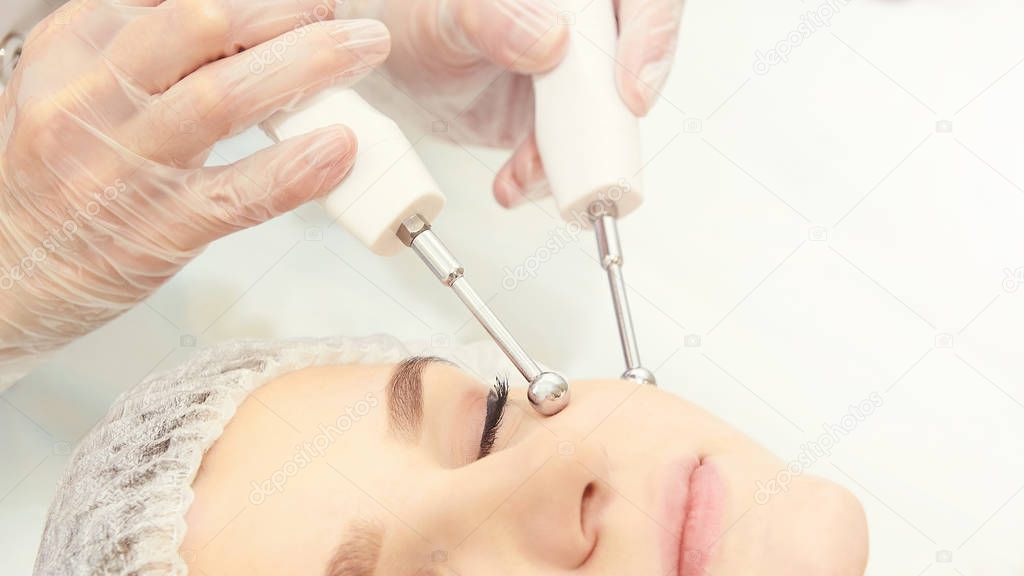 Dermatology skin care facial therapy. Medical spa anto wrinkles procedure. Woman face rejuvenation. Pretty girl. Rf cosmetician equipment
