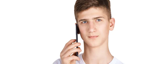 Young boy talking telephone. White shirt at grey background. Male people — Stock Photo, Image