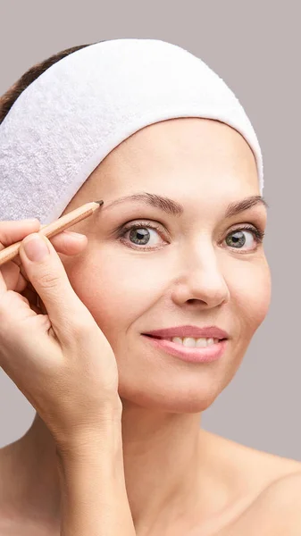Beautician skin care. Face pencil make up. Facial treatment. Woman dermatology — Stock Photo, Image