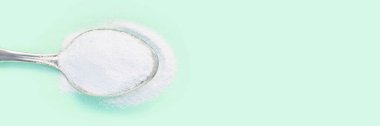 Collagen white powder. Pastel color background. Health product clipart