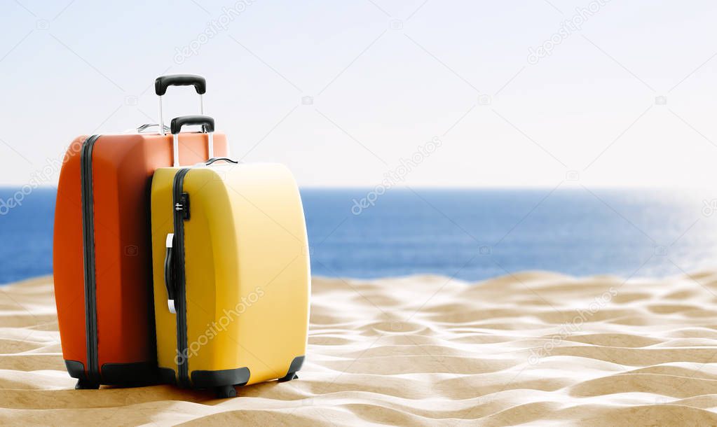 travel theme background with colorful luggage on sand