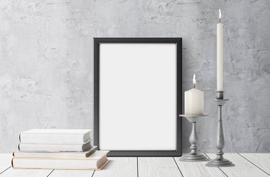 boş çerçeve ile yığılmış kitaplar ve mumlar yaktı