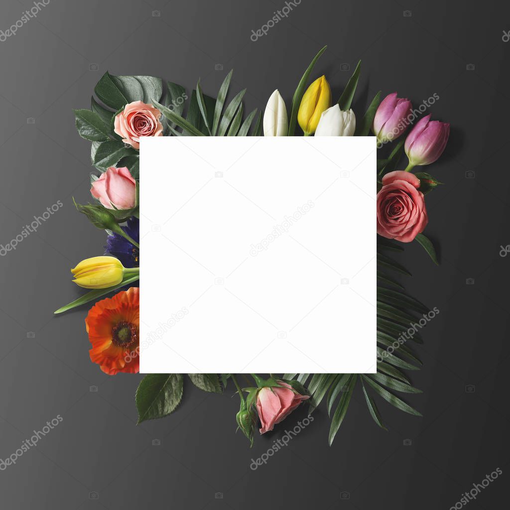 blank paper sheet on fresh colorful flowers