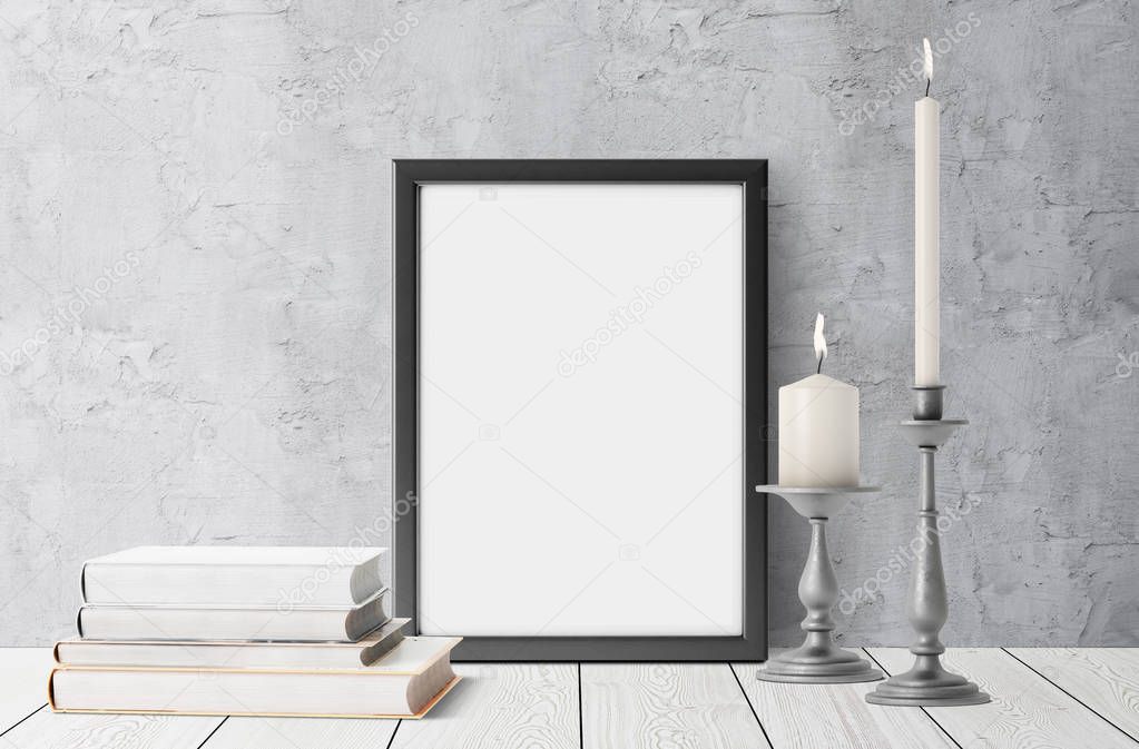 blank frame with stacked books and lit up candles