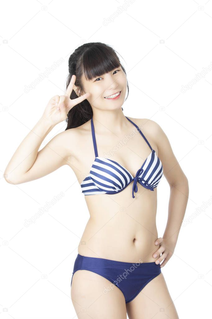 Beautiful Chinese woman wearing a sexy bikini isolated on a white background