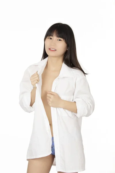 美丽的中国妇女穿着蓝色丁字裤和白色衬衫查出在白色背景 — 图库照片