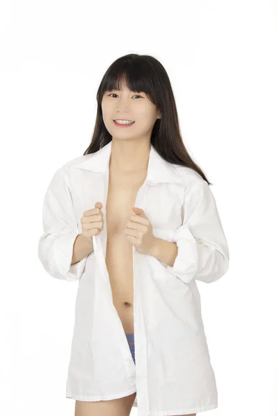 美丽的中国妇女穿着蓝色丁字裤和白色衬衫查出在白色背景 — 图库照片