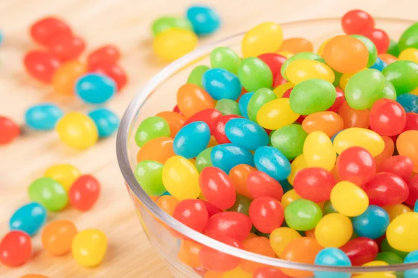 Close Delicious Jelly Beans Candy Glass Bowl Isolated Wooden Background — Stock Photo, Image