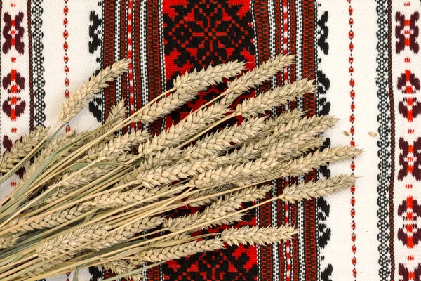 Wheat on ethnic ukrainian traditional ornate background