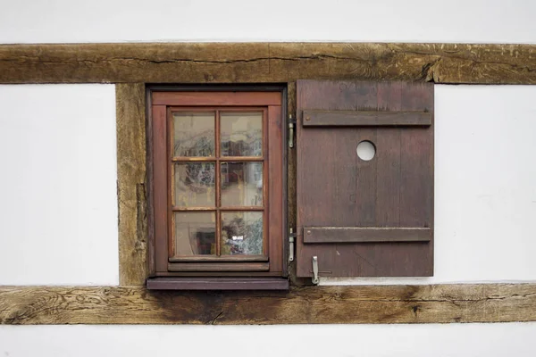 Old ancient wooden window with blind or shutters — Stock Photo, Image