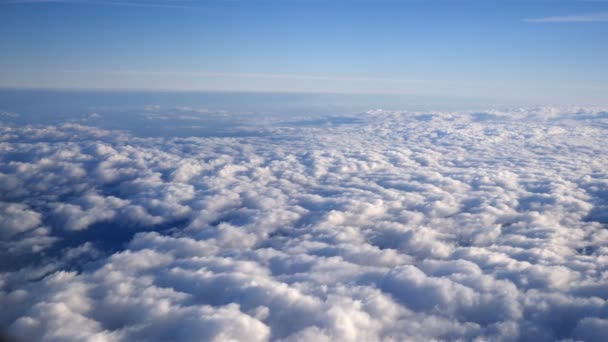 Stunning footage of aerial view above clouds from airplane — Stock Video